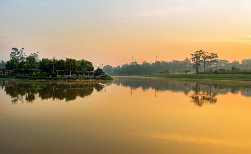 Scenic view of lake against sky during sunset