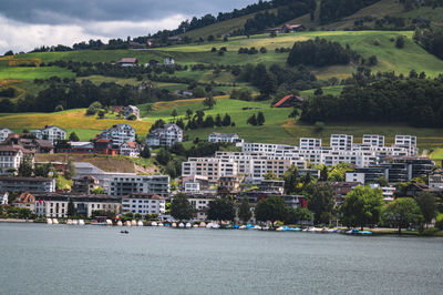 Scenic view of town by buildings in city