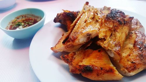 Close-up of grilled chicken on plate