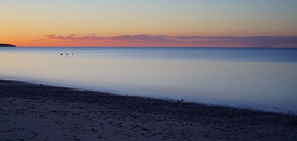 Scenic view of sea at sunset