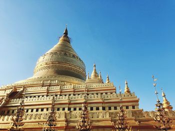 Low angle view of temple against building