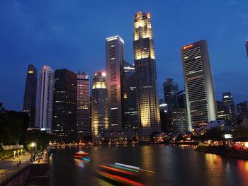 Illuminated city at waterfront