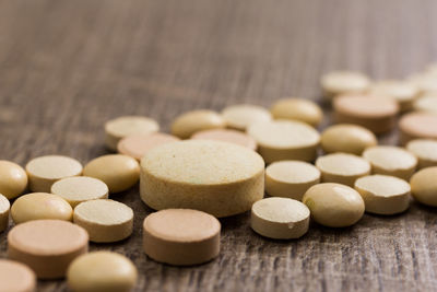 Close-up of medicines on wooden table