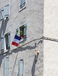 White building with national flag of france