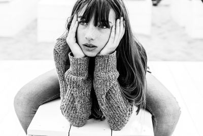 Portrait of a girl sitting outdoors