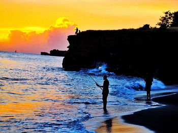 Silhouette of people on beach