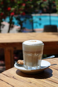 Close-up of cappuccino on table at cafe