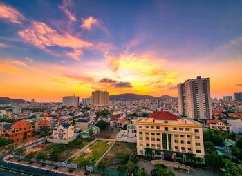 High angle view of buildings against sky during sunset