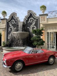 Vintage car against building