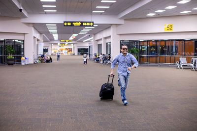 Full length of man running at airport