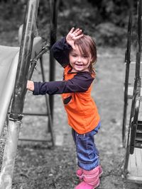 Portrait of boy standing on playground