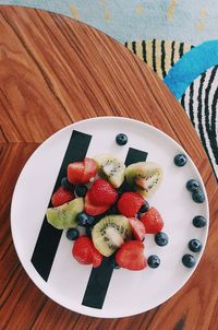 High angle view of fruits in plate on table