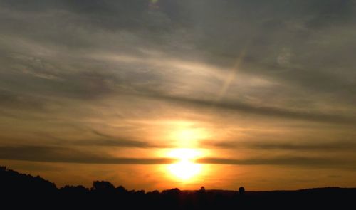 Sun shining through clouds