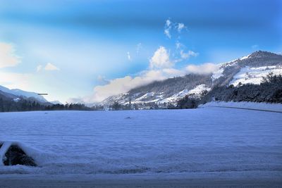 Scenic view of frozen lake against sky