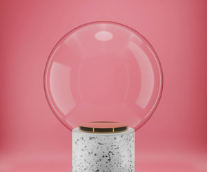 Close-up of light bulb against pink background