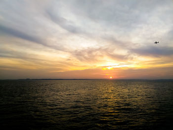 Scenic view of sea against sky during sunset