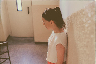 Close-up of young woman standing at home