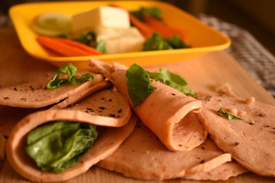 Close-up of chopped vegetables in plate on table