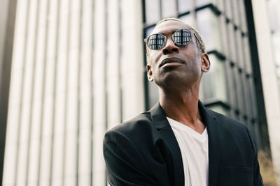 Stylish black businessman on street