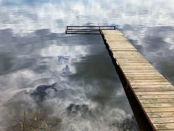 High angle view of pier over lake against sky