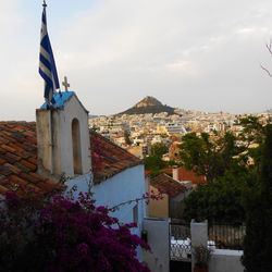 Buildings in city against sky