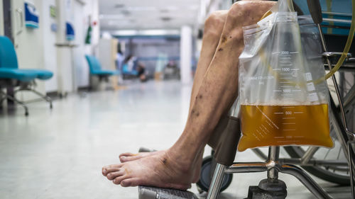 Cropped image of man holding glass