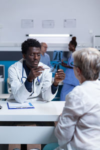 Doctor looking at medical x-ray at clinic