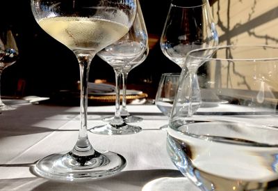 Close-up of wine glasses on table