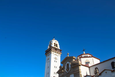 Low angle view of building against blue sky