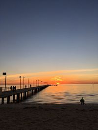 Scenic view of sea against clear sky during sunset