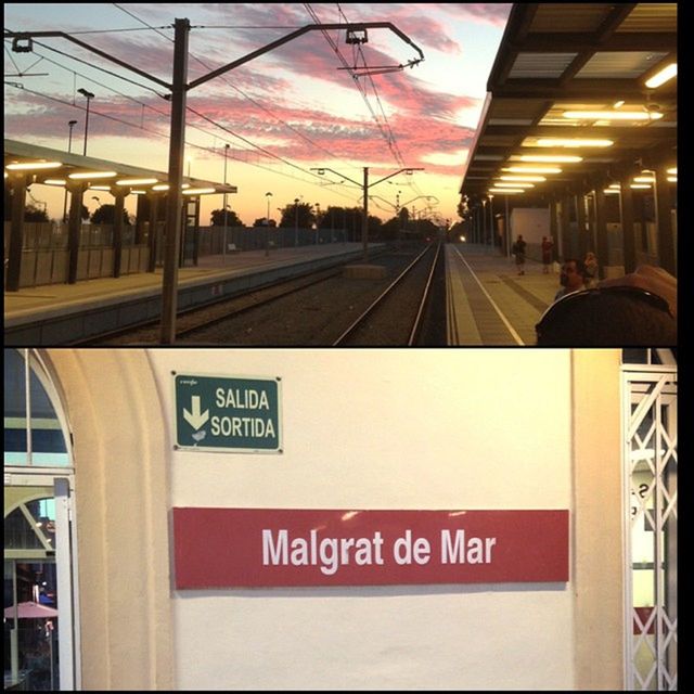 railroad station, transportation, text, public transportation, railroad station platform, communication, built structure, architecture, rail transportation, western script, railroad track, illuminated, sunset, sky, information sign, city, building exterior, train - vehicle, sign, mode of transport