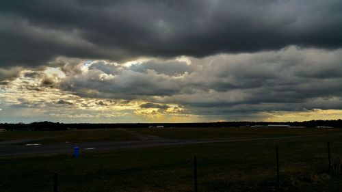 Scenic view of landscape against cloudy sky