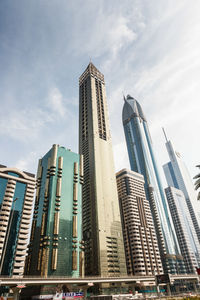 Low angle view of modern buildings in city against sky