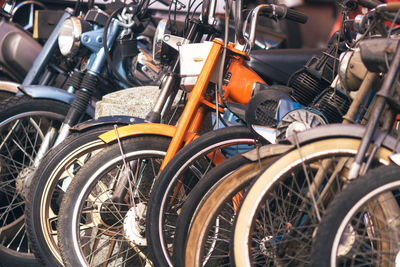 Close-up of bicycles parked on street