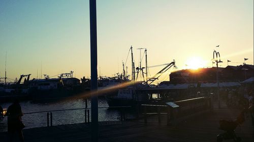 View of harbor at sunset