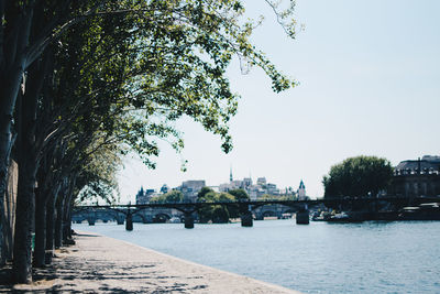 View of river in city against clear sky