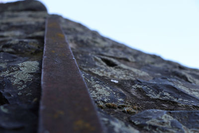 Close-up of rusty metal against clear sky