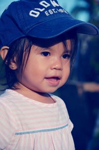 Portrait of a baby girl wearing hat