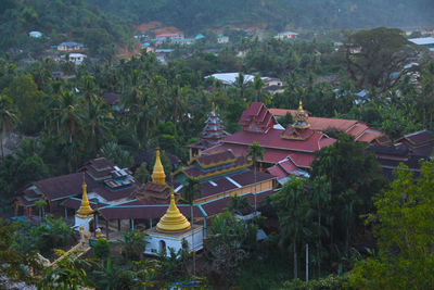 High angle view of buildings and trees in city