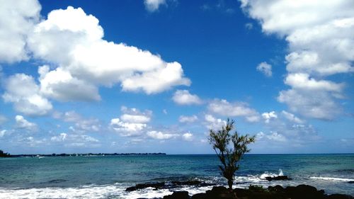 Scenic view of sea against cloudy sky
