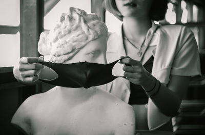 Midsection of woman holding ice cream