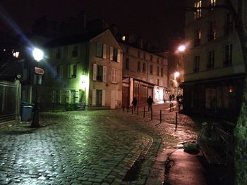 Illuminated street at night