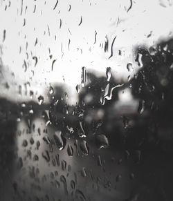 Full frame shot of wet glass window in rainy season