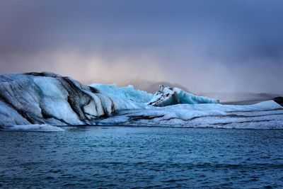 Scenic view of frozen landscape against sky