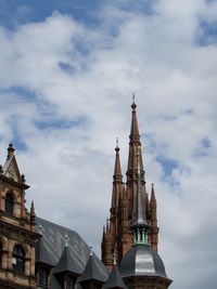 Low angle view of church against cloudy sky