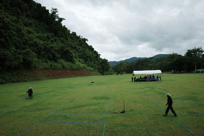 Scenic view of agricultural field against sky