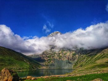 Scenic view of waterfall against sky