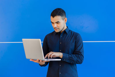 Young man using mobile phone