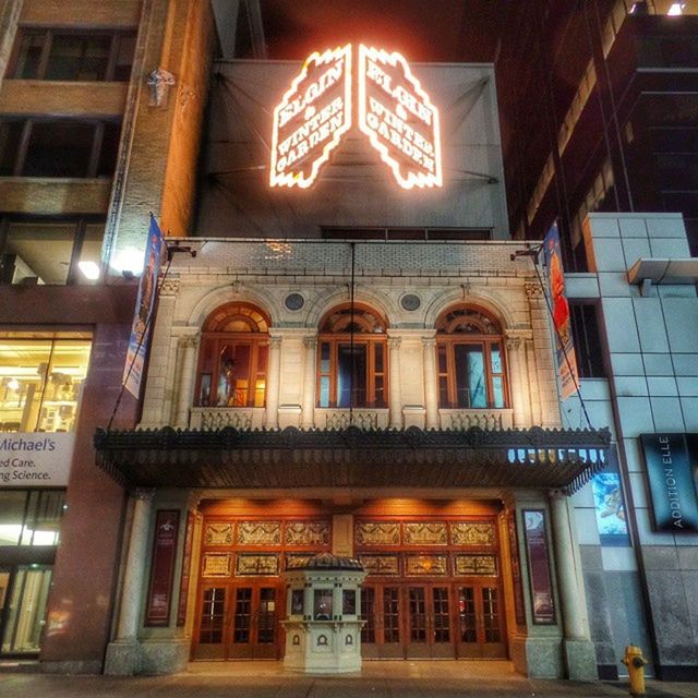 architecture, building exterior, built structure, window, low angle view, illuminated, building, night, residential building, city, facade, lighting equipment, glass - material, residential structure, no people, balcony, outdoors, street light, sky