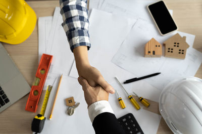 High angle view of man working on table